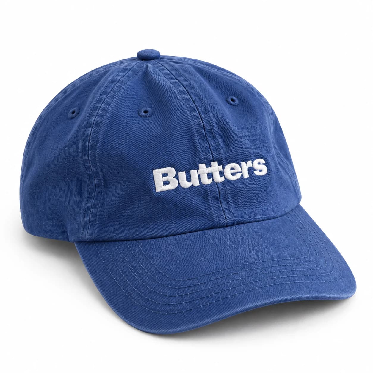 Blue Butters cap with white embroidered lettering on a white background